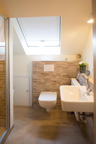 Ένα μπάνιο στο Ferienwohnung im Hasetal