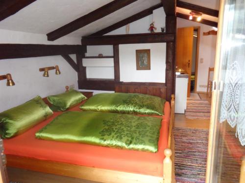 A bed or beds in a room at Gästehaus Eschenhof