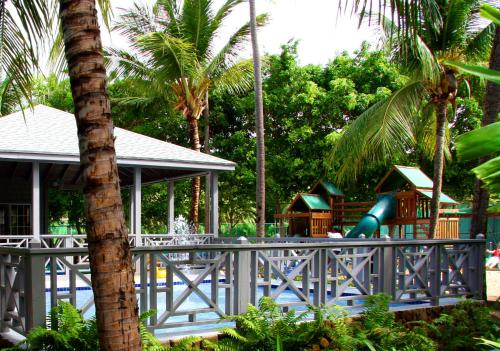 a resort with a playground with a slide at Carlisle Bay in Old Road
