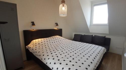 Ένα ή περισσότερα κρεβάτια σε δωμάτιο στο ZON ZEE STRAND Bed by the Sea