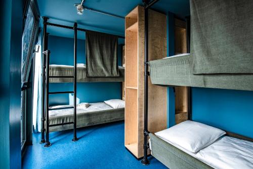 Postel nebo postele na pokoji v ubytování DOCK INN Hostel Warnemünde