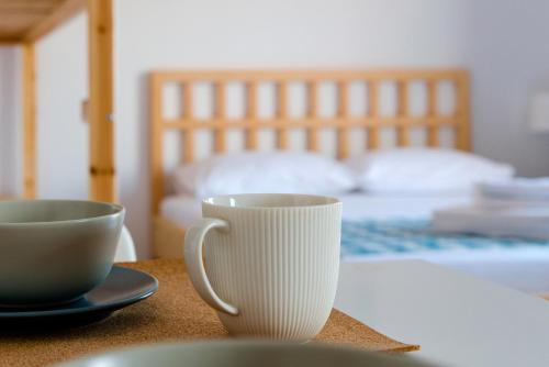 Ένα ή περισσότερα κρεβάτια σε δωμάτιο στο Avli Apartments