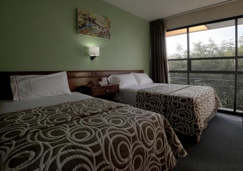 Postel nebo postele na pokoji v ubytování Hotel El Greco