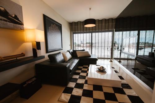 a living room with a couch and a table at Lugar de Belém in Ponta Delgada