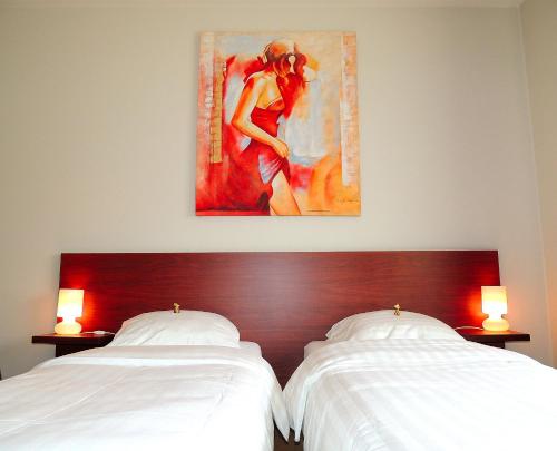 מיטה או מיטות בחדר ב-Hotel Mieke Pap