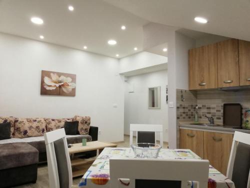 a living room with a couch and a table at Apartmani Beljkas in Tivat