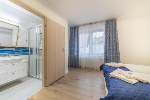 Katil atau katil-katil dalam bilik di Apartamenty Draga
