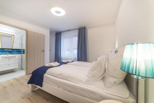 Katil atau katil-katil dalam bilik di Apartamenty Draga