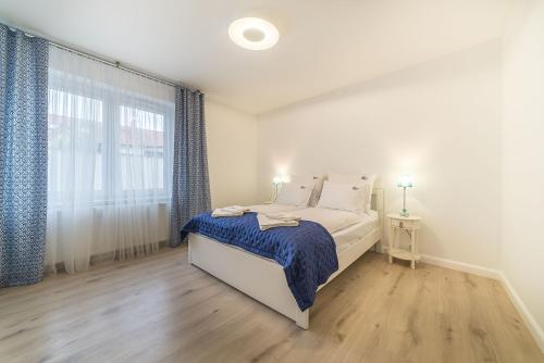 Katil atau katil-katil dalam bilik di Apartamenty Draga