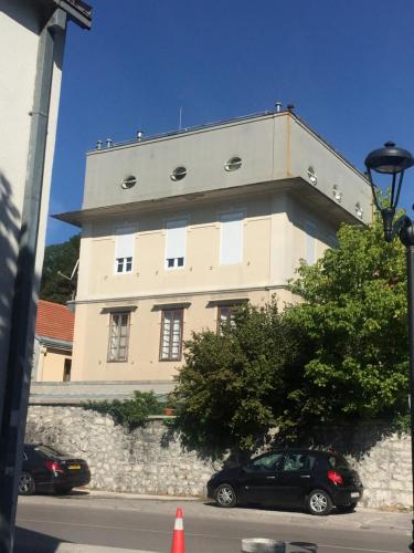 a building with a car parked in front of it at Villa Royal in Cetinje