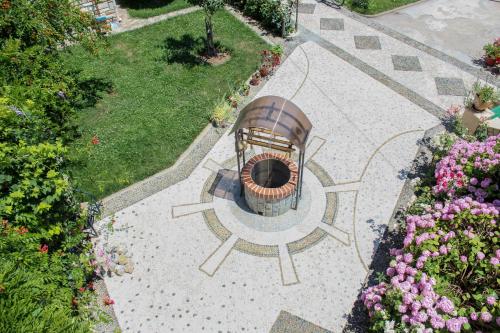an aerial view of a garden with a fountain at Vila Topciu in Pogradec
