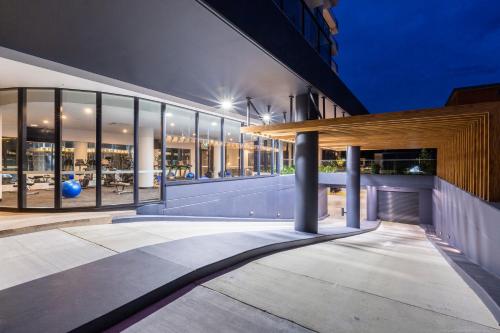 a building with large glass windows on the side of it at Boardwalk Burleigh Beach - Official in Gold Coast