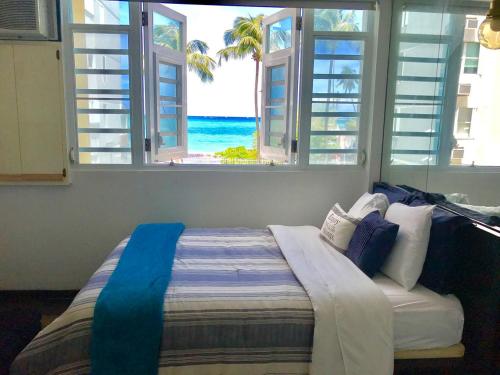 Postel nebo postele na pokoji v ubytování Coco Mar Oceanview Studios