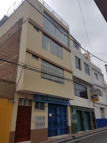 a building with a sign on the side of it at Nino´s Residence Departamentos VIP Amoblados in Tacna