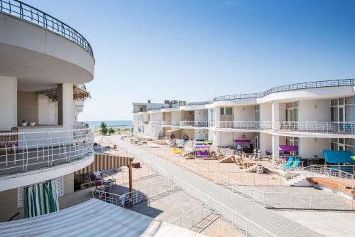 a view of the beach from the balcony of a hotel at Gold Bugaz Apartment near the sea in Karolino-Buhaz