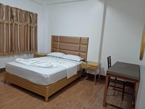 Ένα ή περισσότερα κρεβάτια σε δωμάτιο στο Meaco Hotel - Anilao