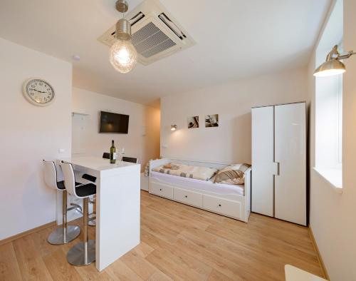 a bedroom with a bed and a desk in a room at Slovanský penzion in Mikulčice
