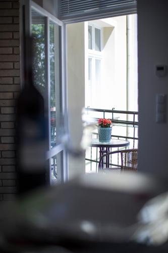 a porch with a table with a potted plant on it at Apartamenty4you - Apartamenty Atlantic in Sopot