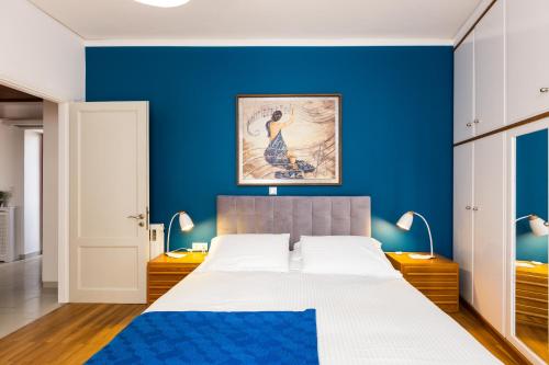 En eller flere senge i et værelse på La Vita Moderna