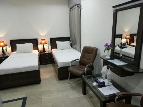 Krevet ili kreveti u jedinici u objektu Al-Fateh Hotel