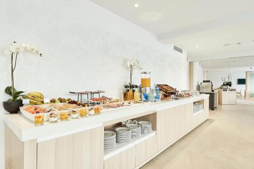 
a kitchen filled with lots of different types of food at Eurostars Ibiza in Ibiza Town
