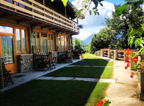 a house with a walkway next to a building at Agriturismo La Selvaggia in Mandello del Lario