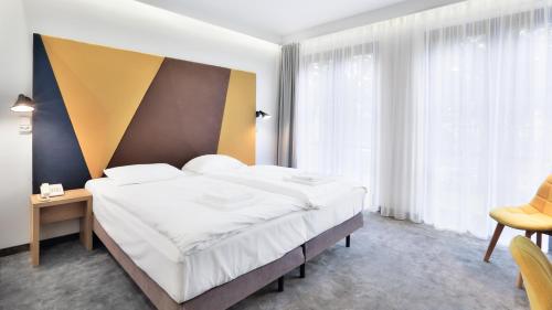 Кровать или кровати в номере Villa Ozone