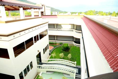 an aerial view of a building with a garden at Athena Hotel in Tiruvannāmalai