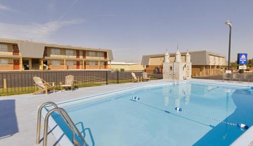 a large swimming pool in front of a building at Americas Best Value Inn Wall in Wall