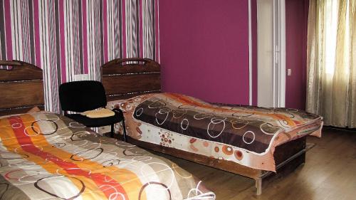 Postel nebo postele na pokoji v ubytování Ushguli Panorama Guest House