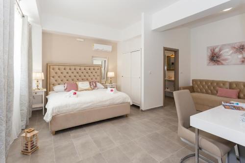 a bedroom with a bed and a couch at Luxury Rooms Saint Jacob in Trogir