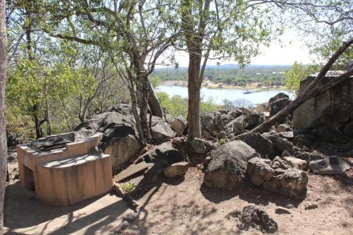 a bath tub sitting on top of a pile of rocks at Tantebane Game Ranch in Tantebane