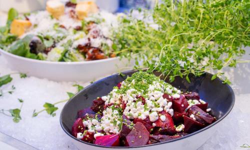 a bowl of food on a table with a salad at Thon Hotel Ski in Ski