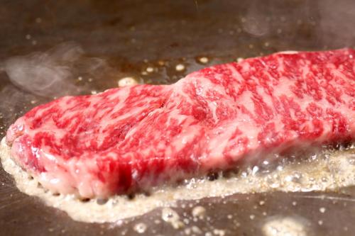 a piece of meat sitting on top of a table at Osaka Tokyu REI Hotel in Osaka