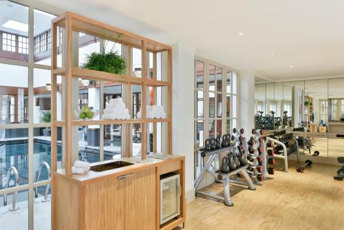 a gym with a lot of treadmills and exercise equipment at The Savoy in London
