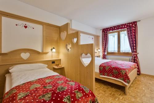 Postel nebo postele na pokoji v ubytování Residence Ronchi