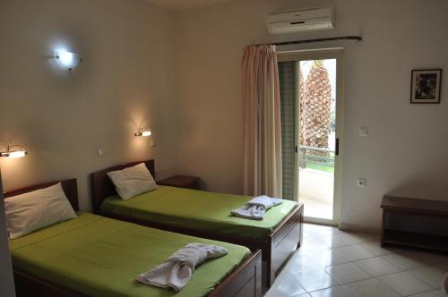 Postel nebo postele na pokoji v ubytování Ostria Hotel