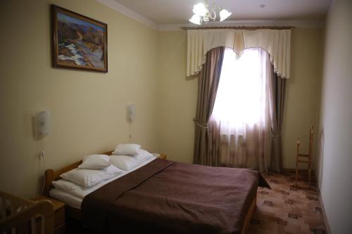 Postel nebo postele na pokoji v ubytování Atlant Hotel