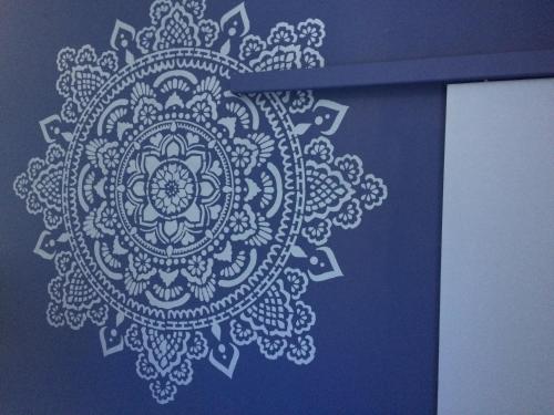 a blue box with a white mandala pattern on it at L'Xpérience in Valgorge