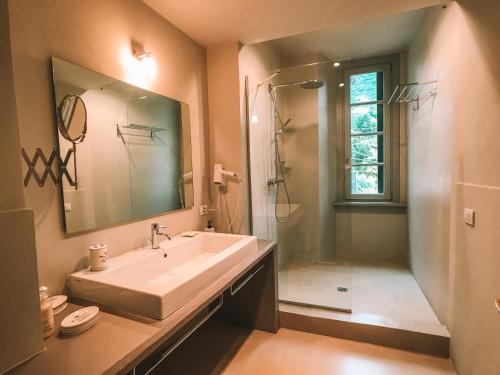 a bathroom with a sink and a shower at Nobiallum B&B in Menaggio