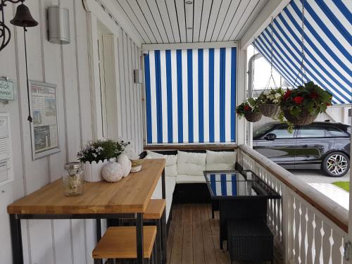 a balcony with a table and a car in the window at Villa Scandic Apartments in Rust