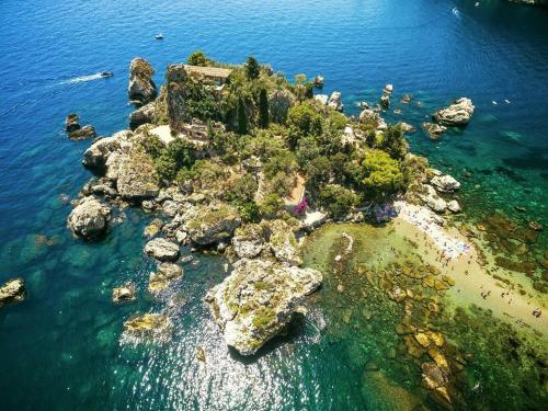 an aerial view of a rocky island in the water at Holiday Home Gionny & Mary in Taormina