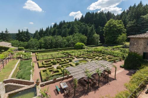 an aerial view of a garden with a bench at Badia a Coltibuono in Gaiole in Chianti