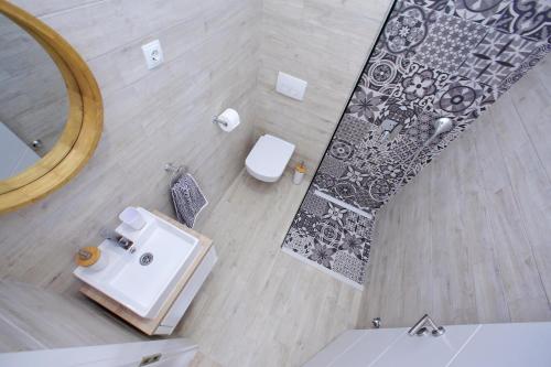 an overhead view of a bathroom with a sink and a mirror at Apartment Mia in Bibinje