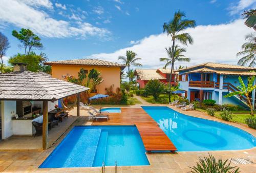 an image of a villa with a swimming pool at Residence Pé na Areia in Arraial d'Ajuda