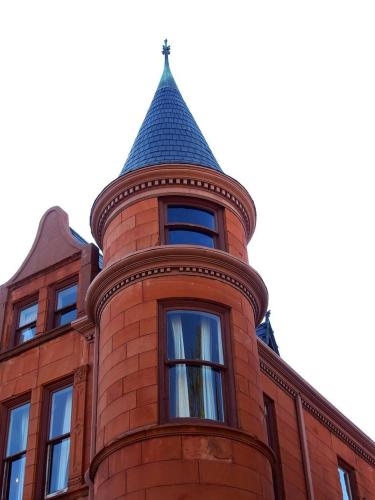 a building with a tower on top of it at Patterson Inn in Denver
