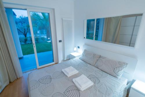 Oleeva Apartment tesisinde bir odada yatak veya yataklar