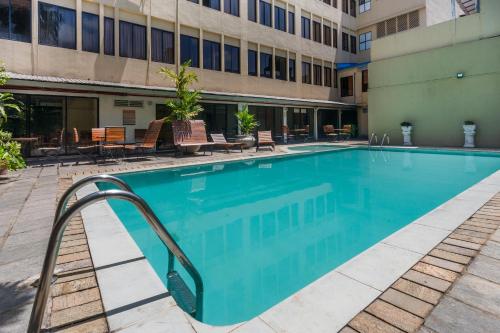 a swimming pool in an apartment building at Hotel Janaki in Colombo