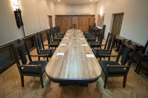 a large conference room with a long table and chairs at Nane Hotel in Gyumri