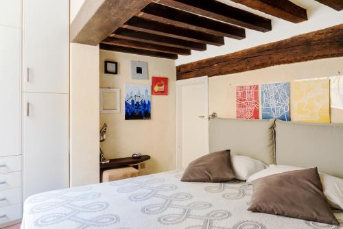 מיטה או מיטות בחדר ב-PALAZZO CORDERO APARTMENT